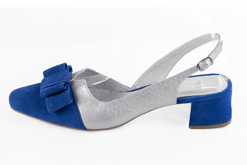 Electric blue and light silver women's open back shoes, with a knot. Round toe. Low flare heels. Profile view - Florence KOOIJMAN